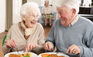 Older couple enjoying a meal together