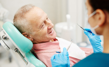 Older man sitting in the dentist’s chair