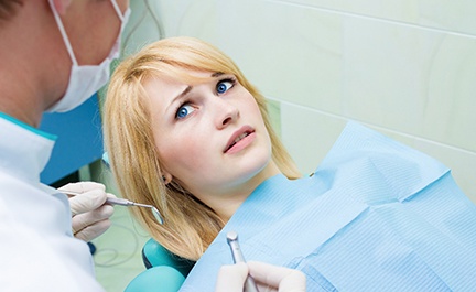 Woman afraid at the dentist