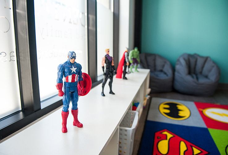 Comic book figurines in kid waiting area