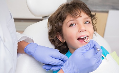 Young child receiving dental exam