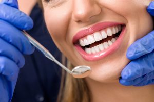 See your dentist in Long Island City at least twice a year to keep your smile healthy. 