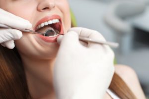 woman smiling receiving preventive care