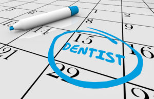 Calendar reminding patient to visit Long Island City dentist