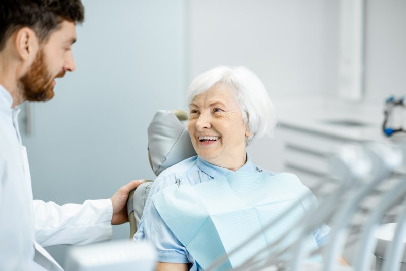 woman speaking with dentist about cosmetic dentistry in Long Island City