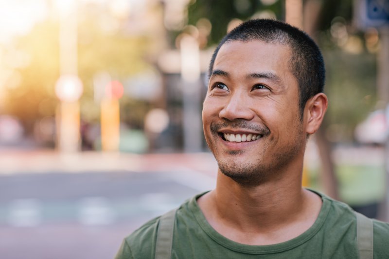 Man smiling with dental implants