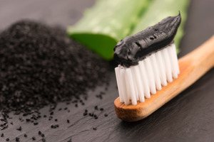 Activated charcoal toothpaste for DIY teeth whitening